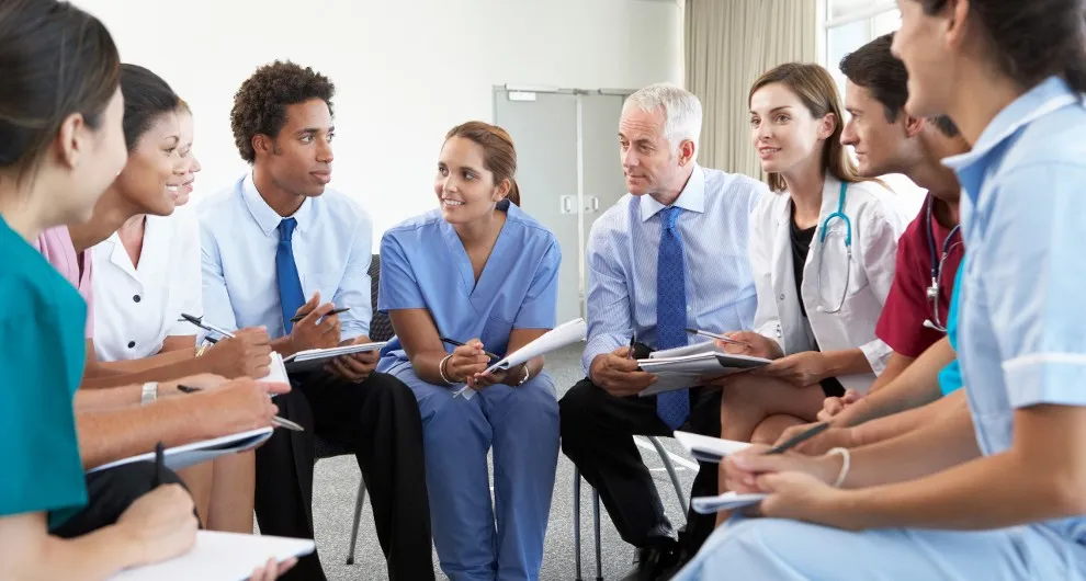 nurses and healthcare members meeting in a behavioral health setting